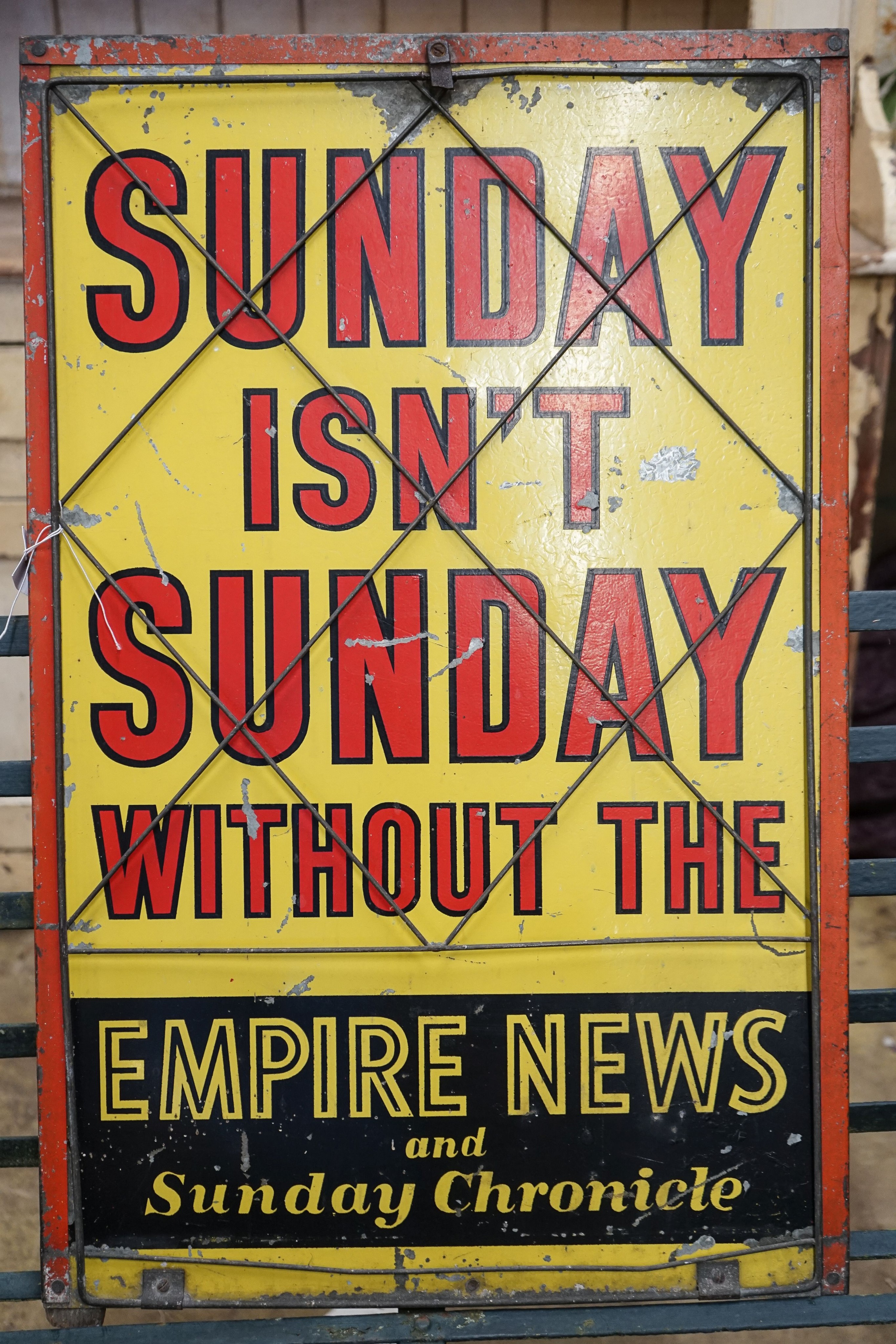 A mid century rectangular tin newspaper advertising sign, width 50cm, height 80cm